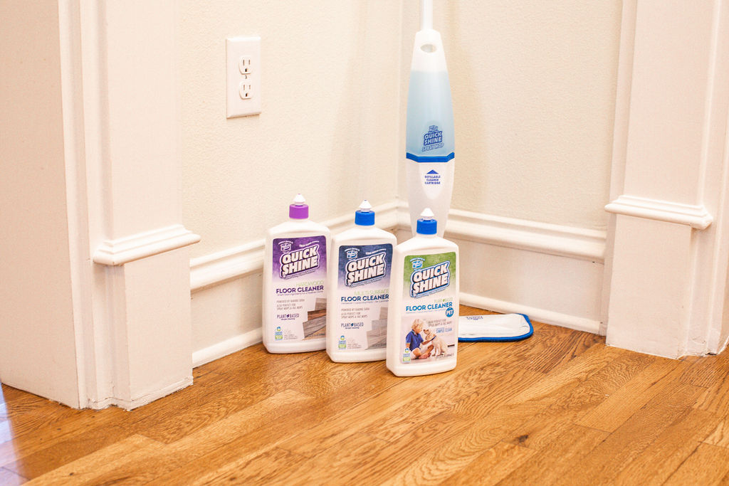 spray mop with cleaners on wood floor